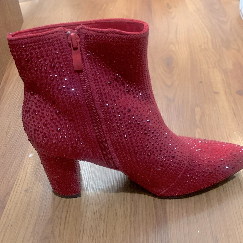 Brand new, never worn, ankle booties. All over Rhinestones.